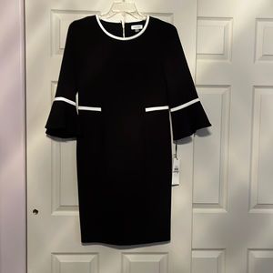 Calvin Klein, Black with white trim. Black zipper, bell sleeves. Size 12